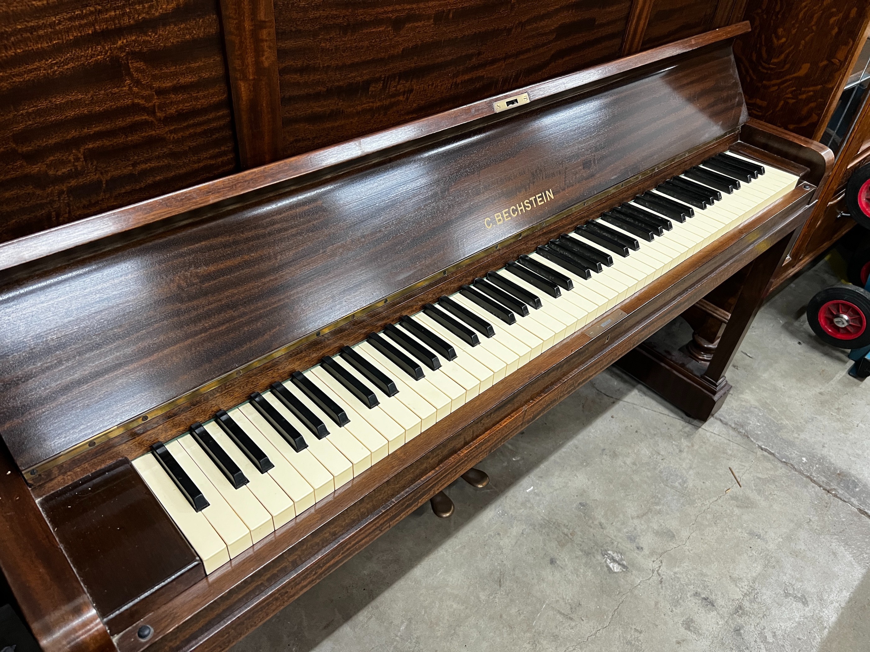 An early 20th century Bechstein mahogany cased upright piano, number 137164 (1929-30), width 156cm, height 129cm